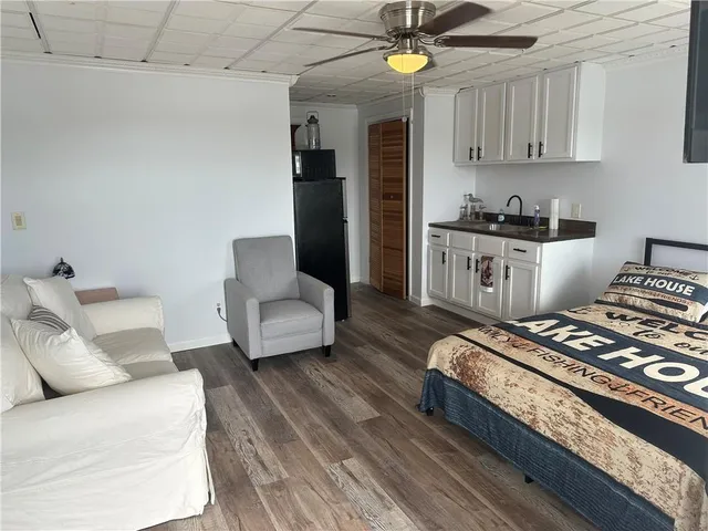 a living room with furniture and a rug