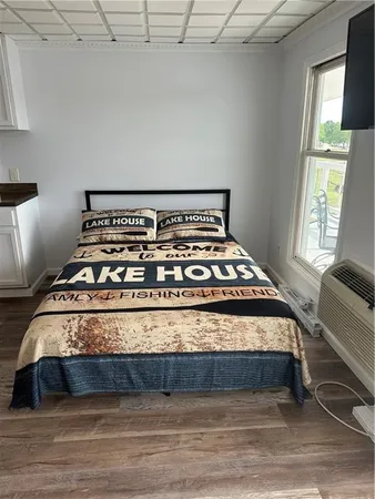 a view of a bed in a bedroom