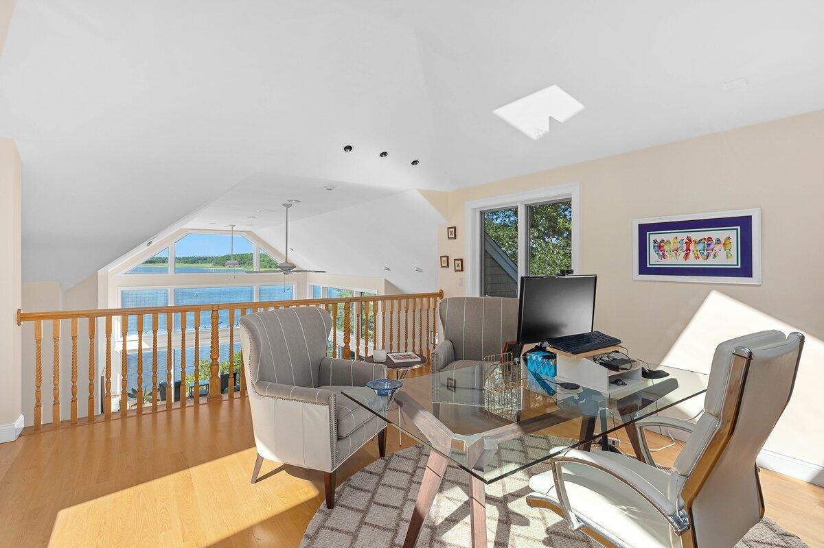 77 Tide Run Mashpee, MA 02649 - Photo 11 of 44 a living room with furniture a rug and a window