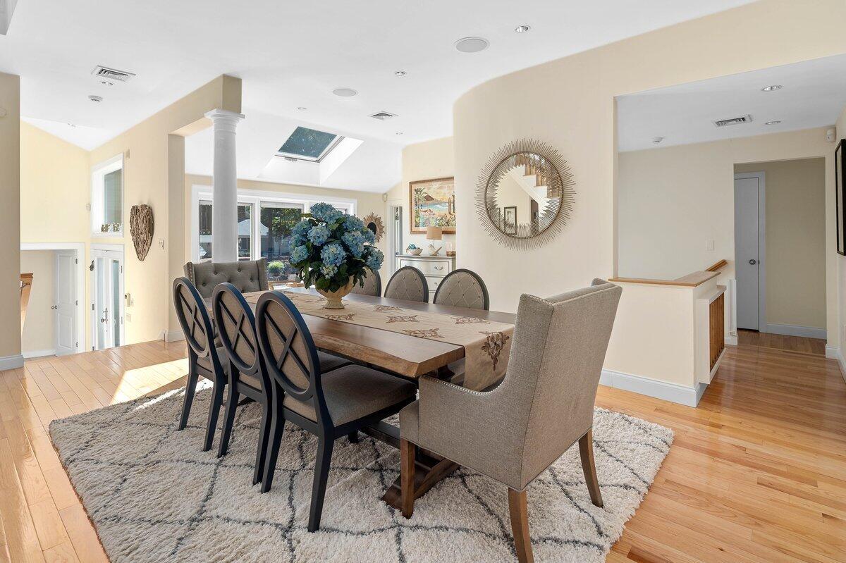 77 Tide Run Mashpee, MA 02649 - Photo 16 of 44 a dining room with furniture and wooden floor