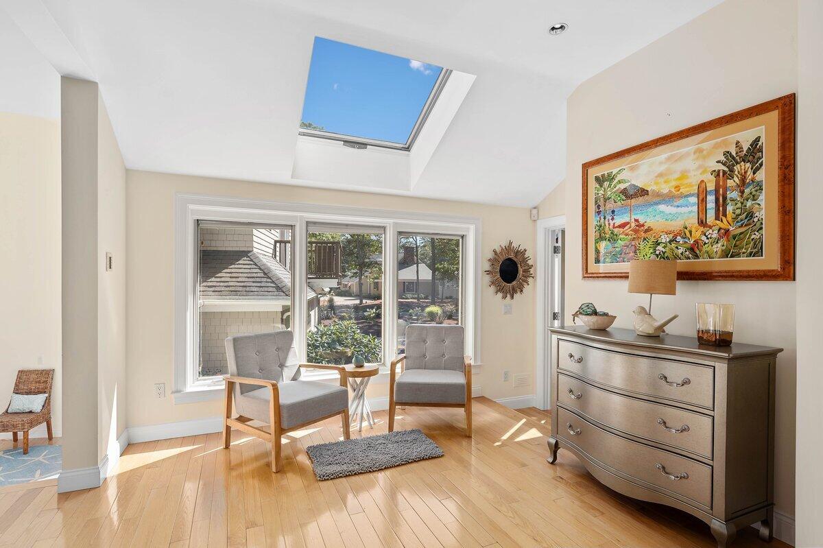 77 Tide Run Mashpee, MA 02649 - Photo 18 of 44 a living room with furniture and wooden floor