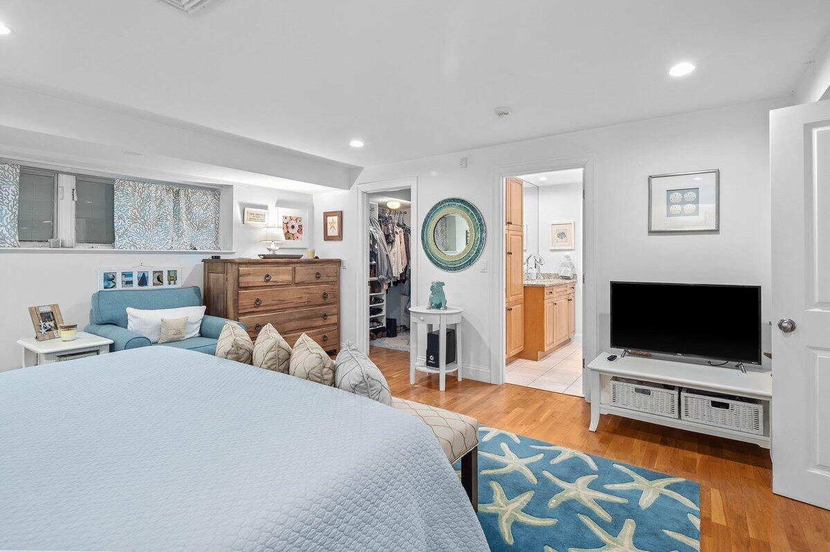 77 Tide Run Mashpee, MA 02649 - Photo 20 of 44 a bedroom with furniture and a flat screen tv