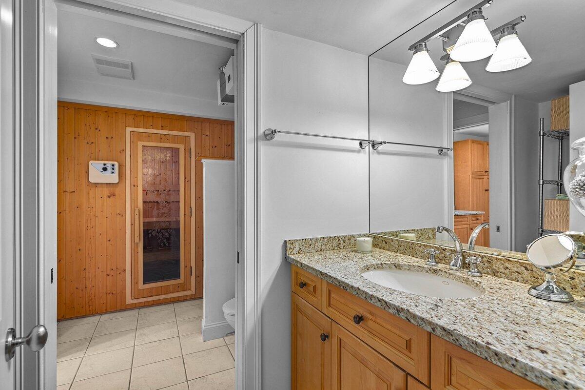 77 Tide Run Mashpee, MA 02649 - Photo 21 of 44 a bathroom with a granite countertop sink and a mirror