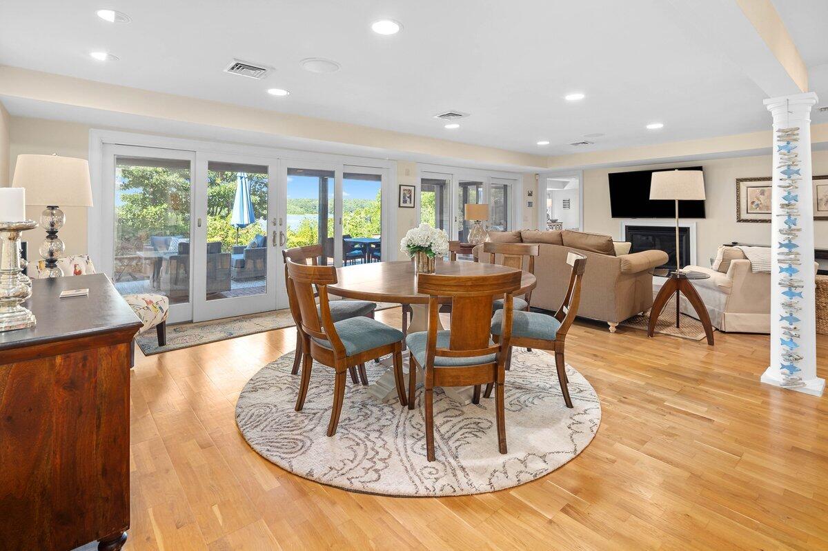 77 Tide Run Mashpee, MA 02649 - Photo 22 of 44 a view of a dining room with furniture window and wooden floor