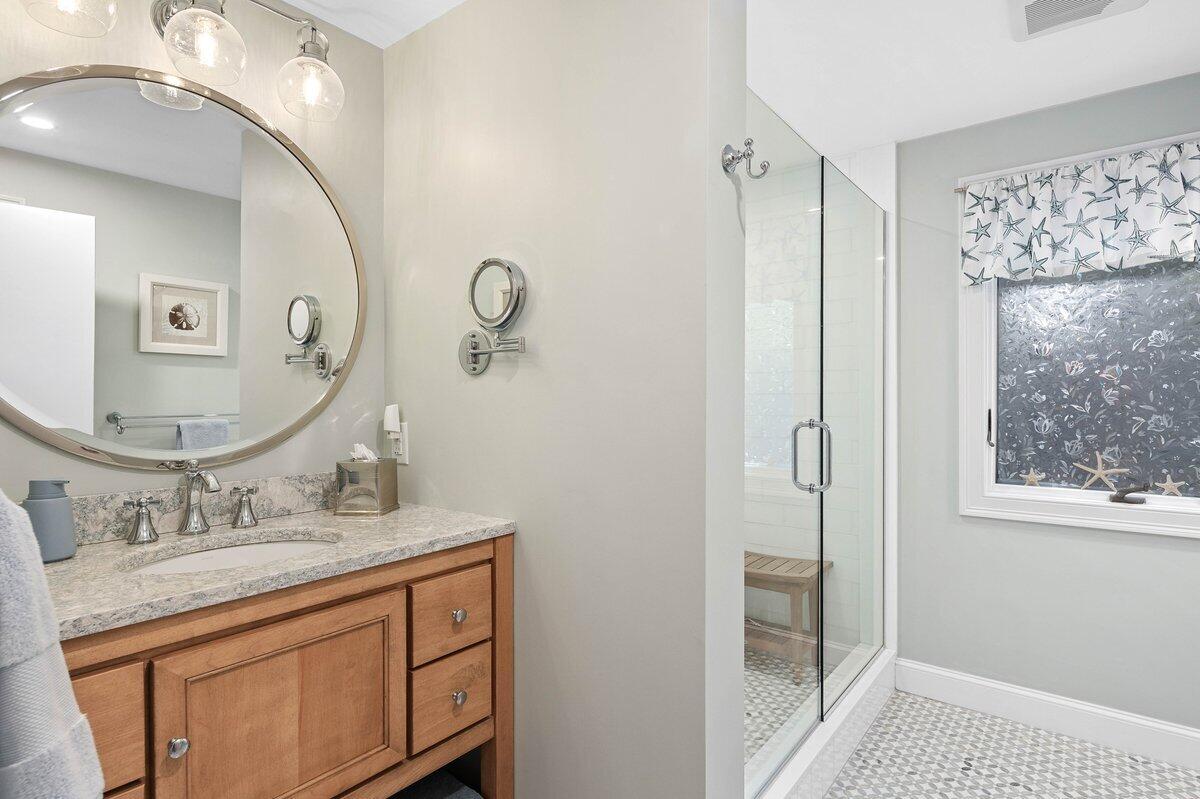 77 Tide Run Mashpee, MA 02649 - Photo 29 of 44 a bathroom with a sink a vanity and a mirror