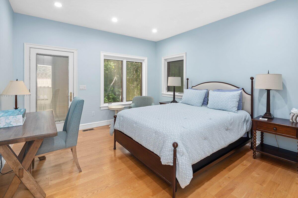 77 Tide Run Mashpee, MA 02649 - Photo 30 of 44 a bedroom with a bed a table and chair