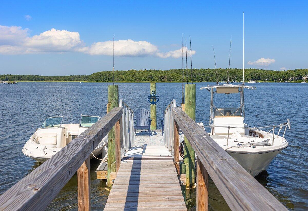 77 Tide Run Mashpee, MA 02649 - Photo 38 of 44 a balcony with wooden floor and city view