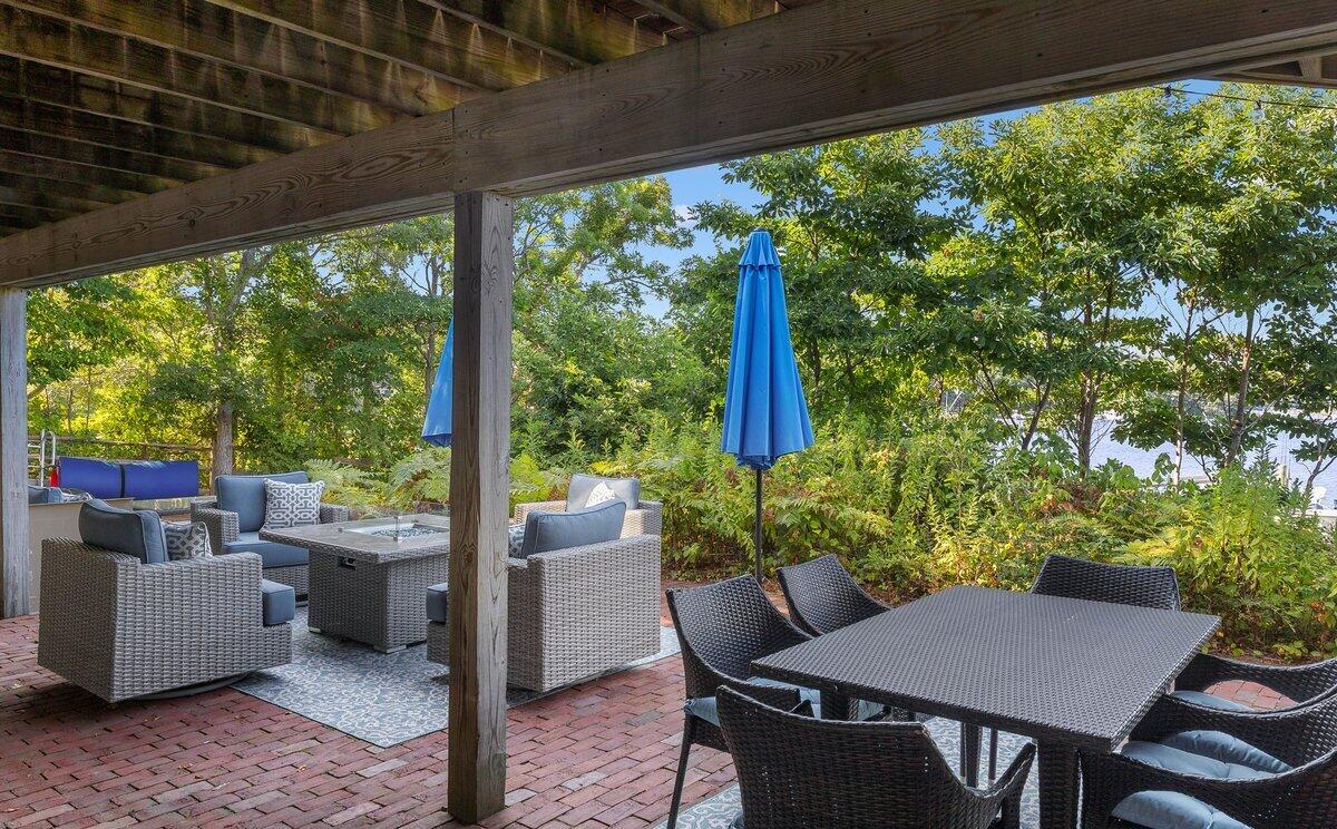 77 Tide Run Mashpee, MA 02649 - Photo 43 of 44 a view of an outdoor dining space with furniture and garden view
