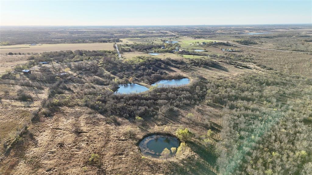 1234 Kirkland Hill Road Axtell, TX 76624 - Photo 6 of 9 an aerial view of residential houses with outdoor space