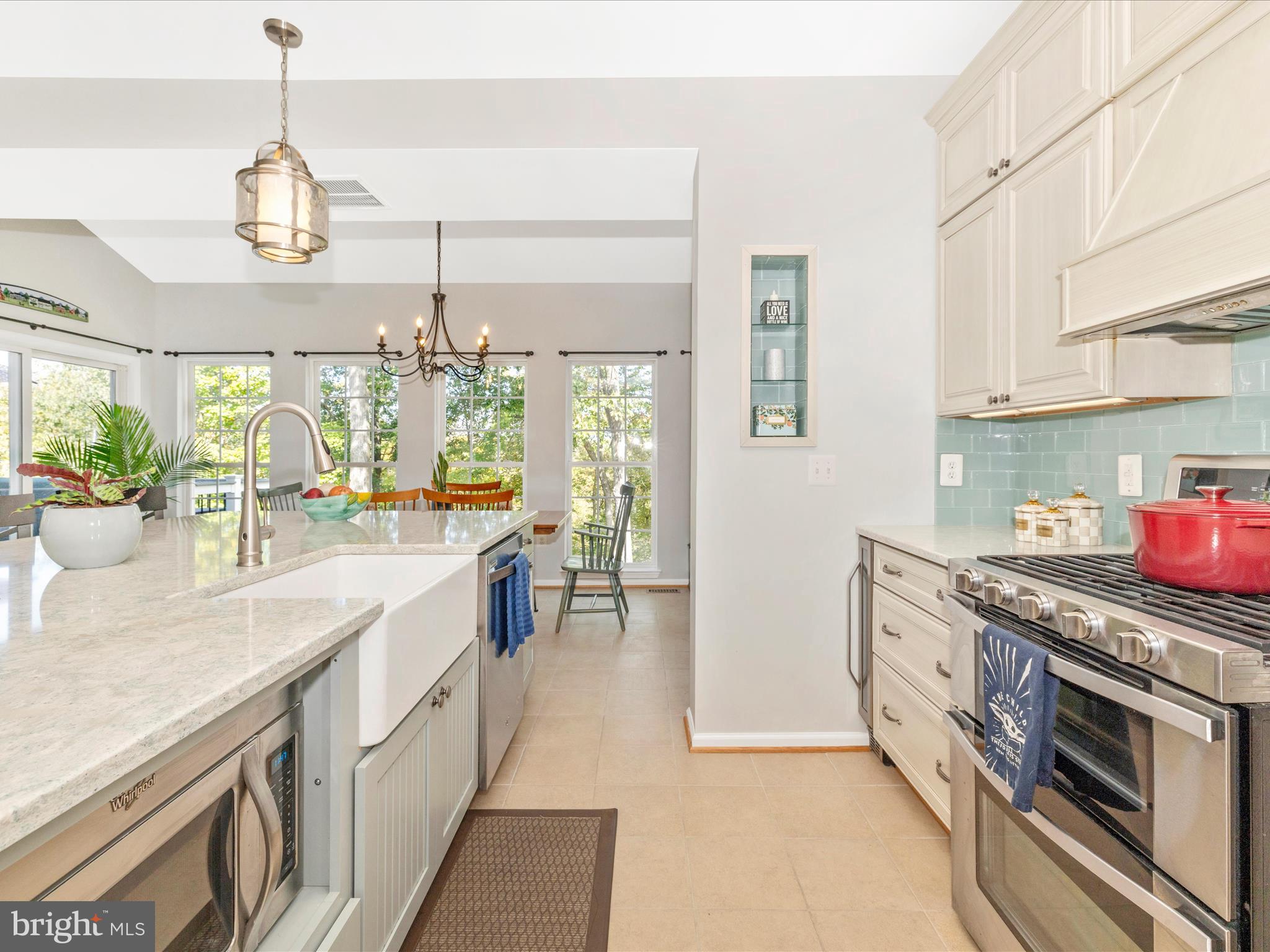 11046 Country Club Road New Market, MD 21774 - Photo 16 of 105 a kitchen with stainless steel appliances granite countertop a sink and a stove