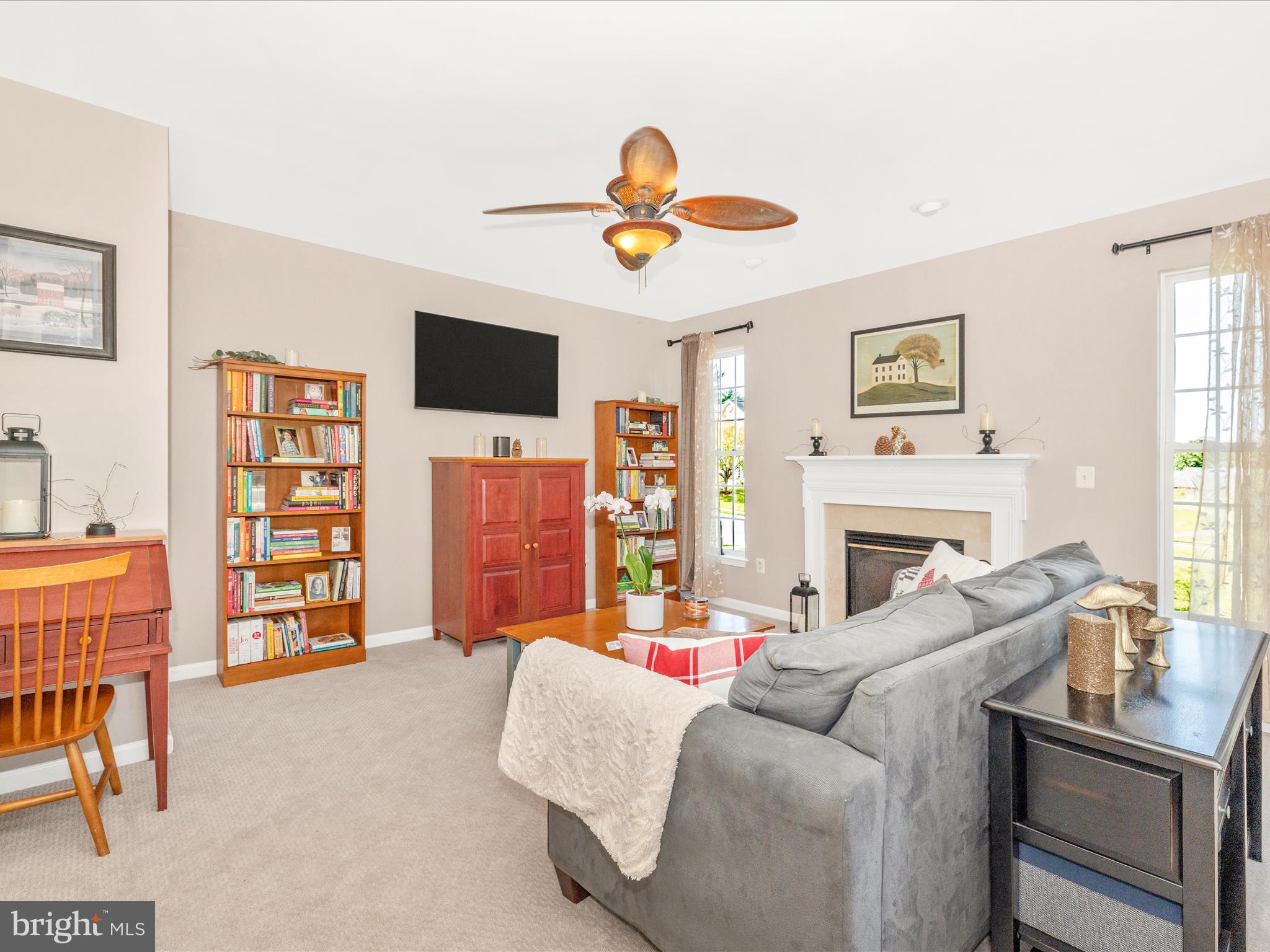 11046 Country Club Road New Market, MD 21774 - Photo 24 of 105 a living room with furniture a flat screen tv and a fireplace