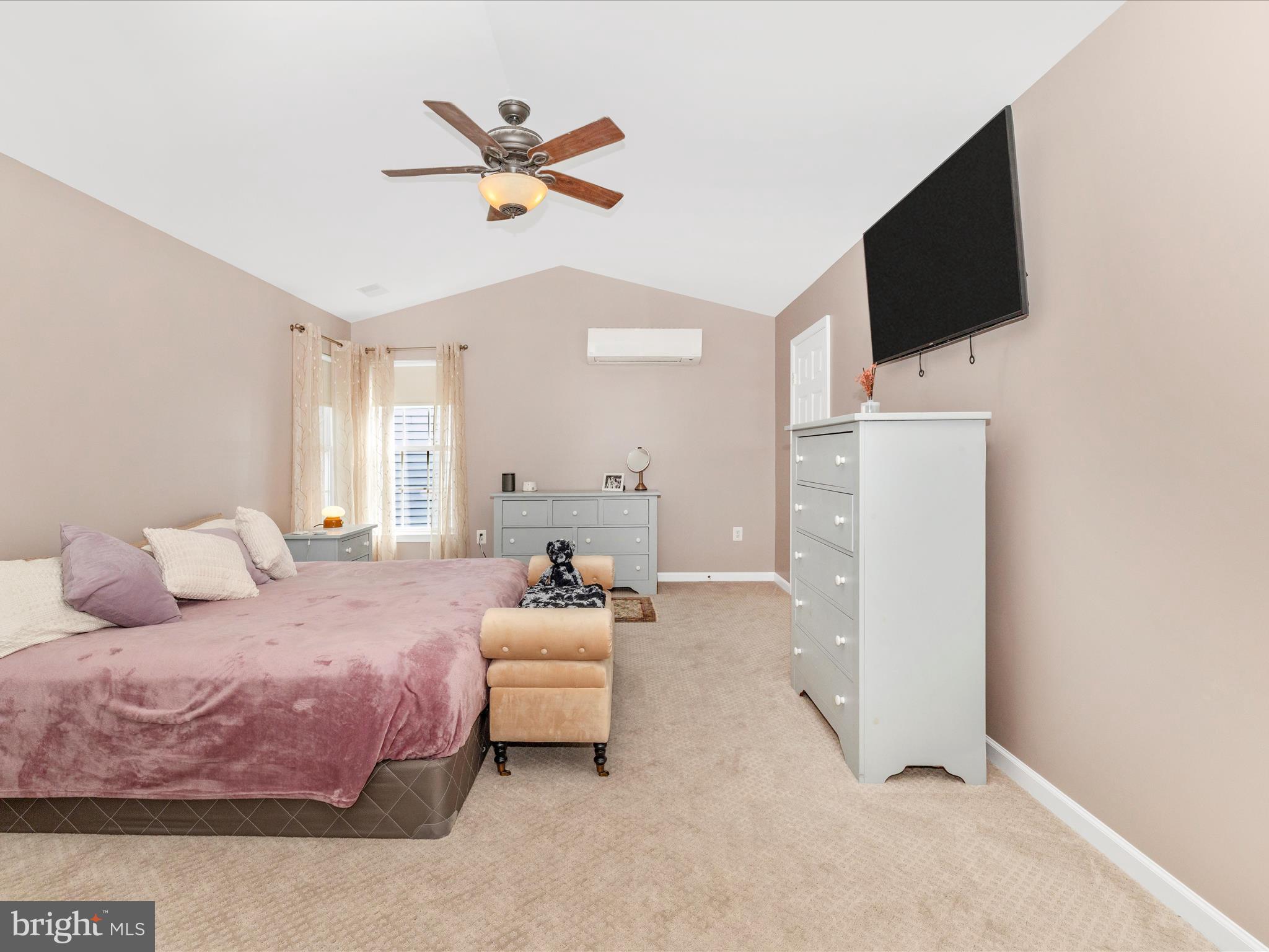 11046 Country Club Road New Market, MD 21774 - Photo 30 of 105 a bedroom with a bed flat screen tv and a ceiling fan