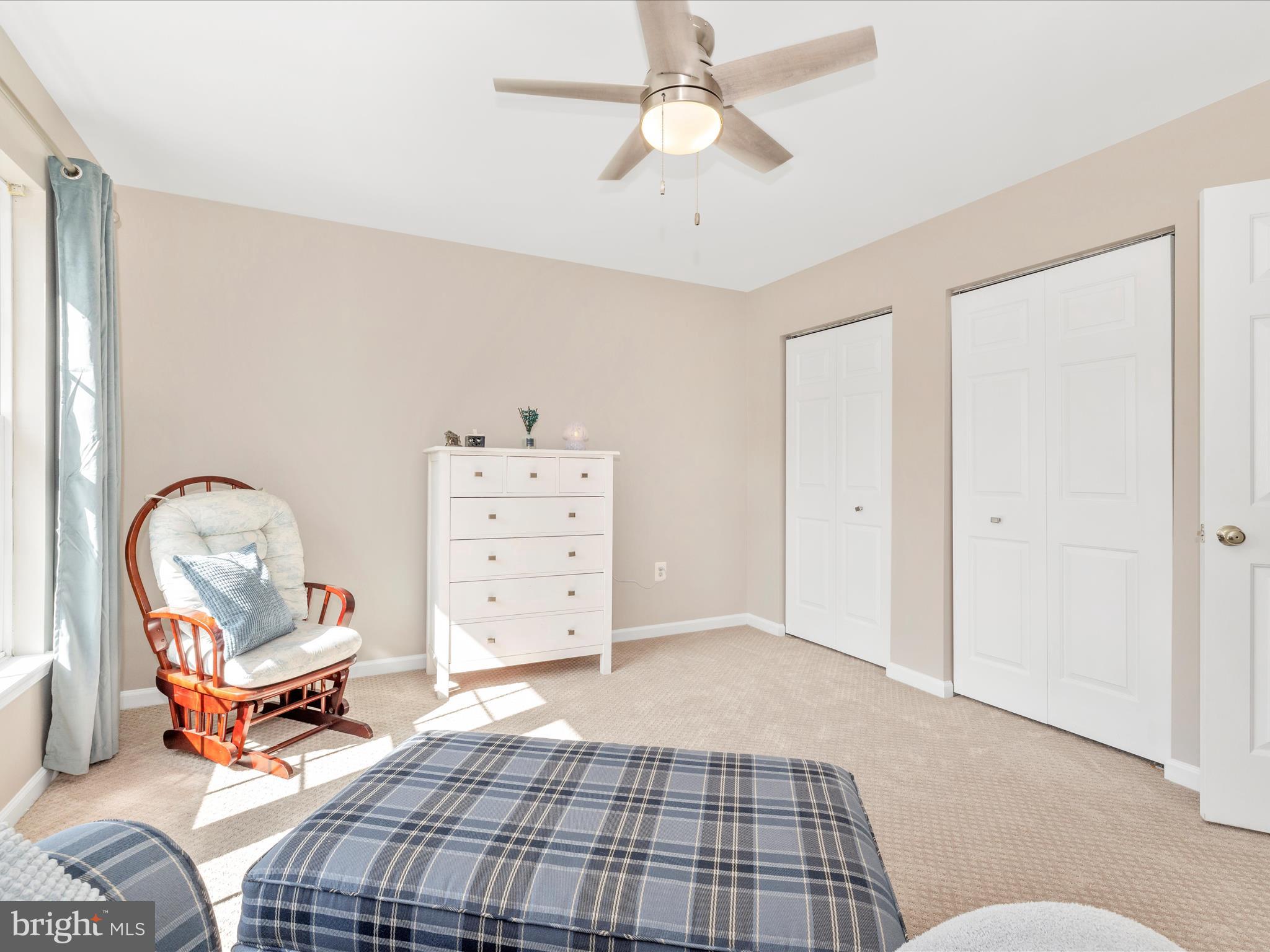 11046 Country Club Road New Market, MD 21774 - Photo 39 of 105 a bedroom with a bed and a chandelier