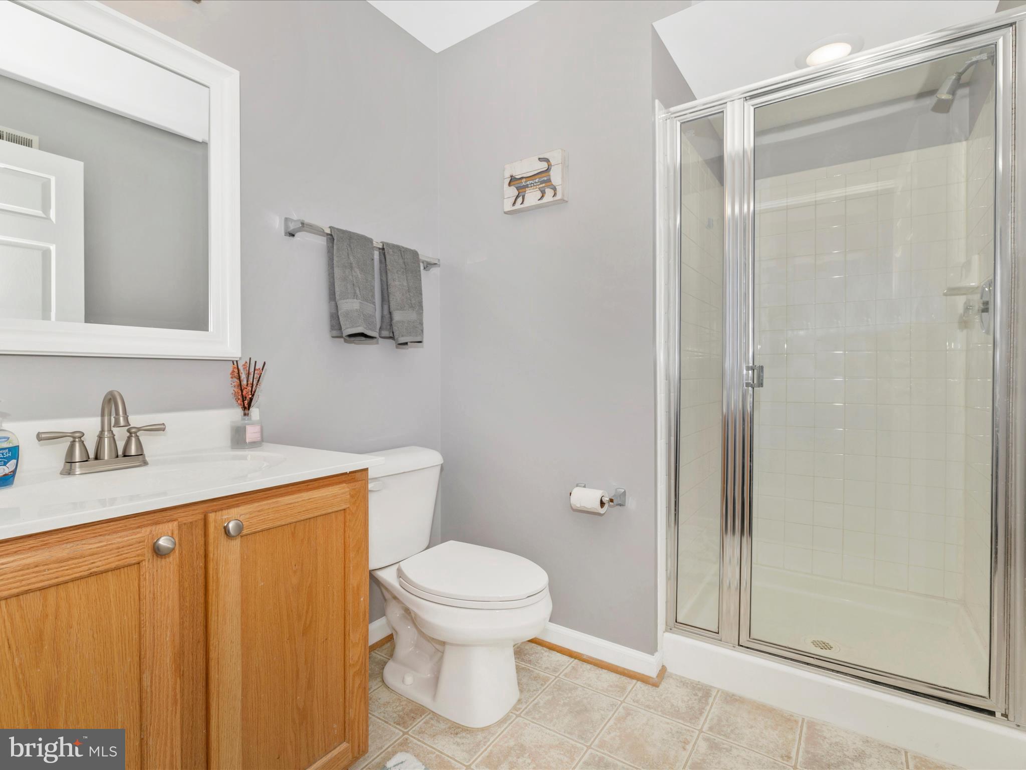 11046 Country Club Road New Market, MD 21774 - Photo 46 of 105 a bathroom with a granite countertop sink toilet and shower