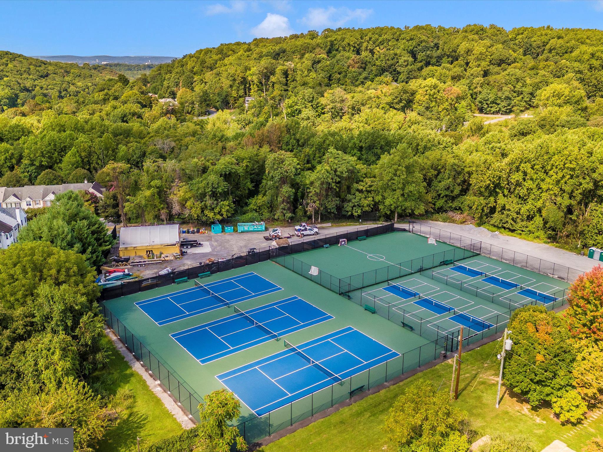 11046 Country Club Road New Market, MD 21774 - Photo 97 of 105 a view of a tennis ground with a large trees