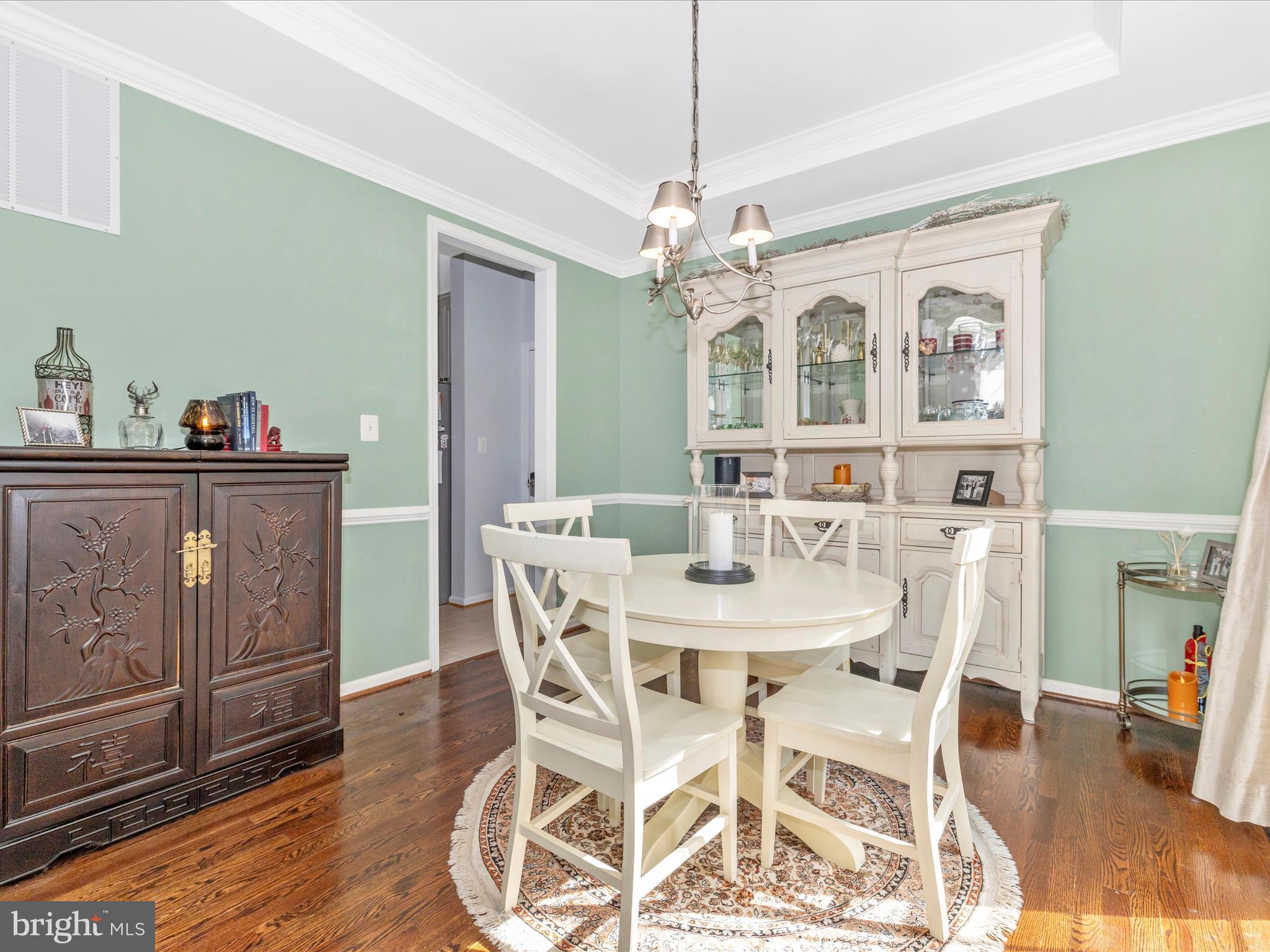 11046 Country Club Road New Market, MD 21774 - Photo 10 of 105 a view of a dining room with furniture wooden floor and chandelier
