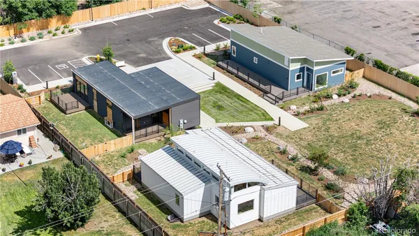 an aerial view of a house with a yard