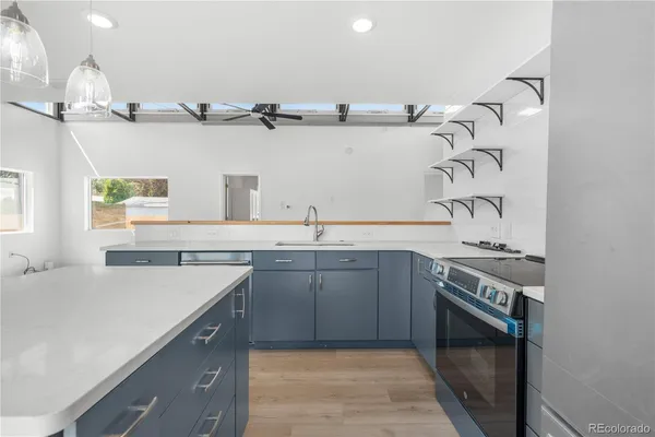 a kitchen with a sink and a stove