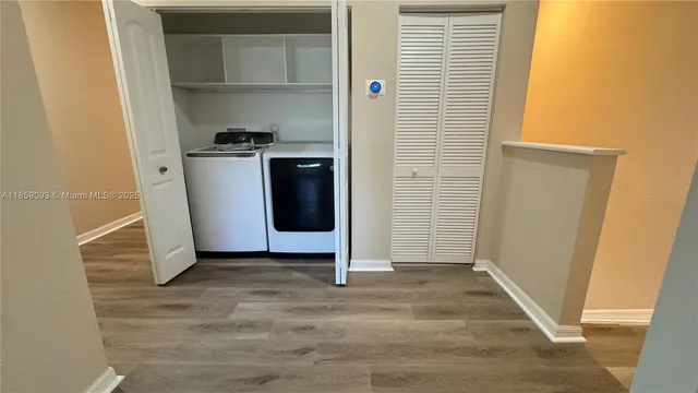 a view of a space with wooden floor