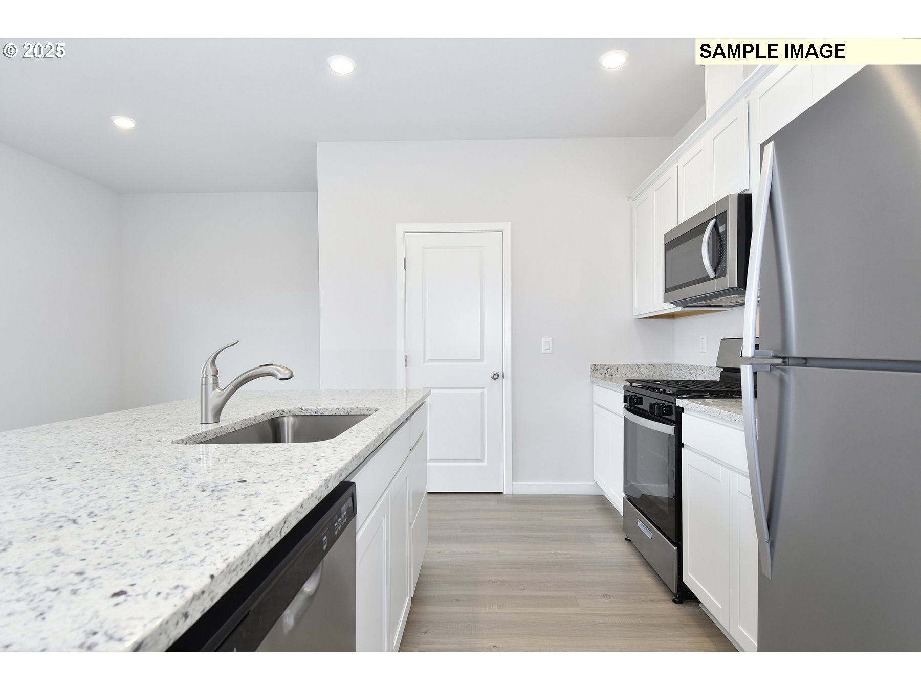 1122 Parkside Avenue Woodburn, OR 97071 - Photo 9 of 22 a kitchen with stainless steel appliances granite countertop a sink stove and refrigerator