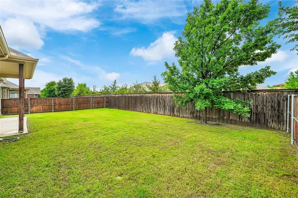 a view of a yard with a slide