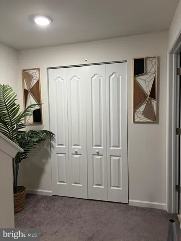a view of a storage & utility room with a window