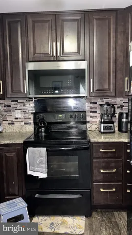 a kitchen with a stove and a sink