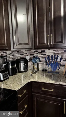 a kitchen with sink and granite counter tops