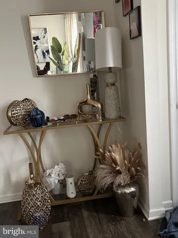 a table with a vase and flowers on it