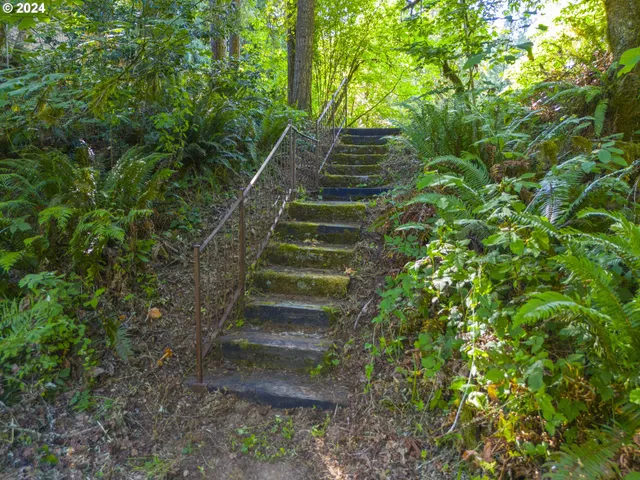 a living room with furniture and a mirror