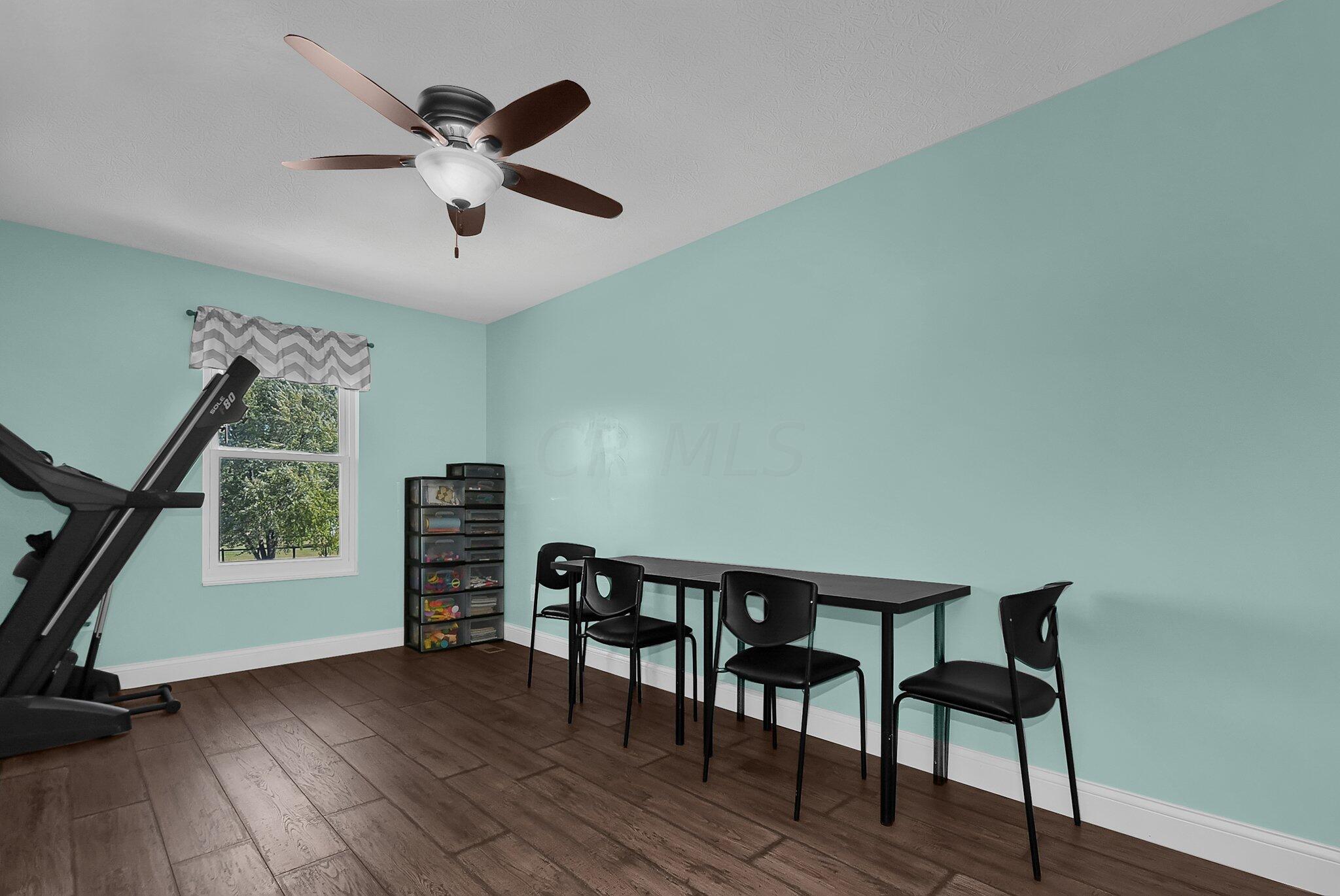 3620 Hyatts Road Powell, OH 43065 - Photo 32 of 54 2nd floor bedroom with mint green walls and brown LVT flooring.