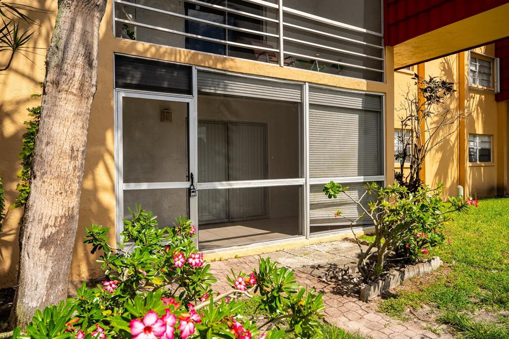 22605 Southwest 66th Avenue, Unit 102 Boca Raton, FL 33428 - Photo 12 of 27 a view of a entrance of the house