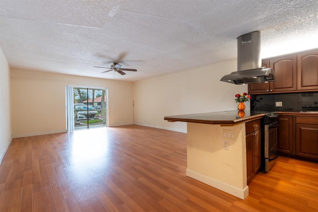 22605 Southwest 66th Avenue, Unit 102 Boca Raton, FL 33428 - Photo 18 of 27 a view of a kitchen with a sink and a window