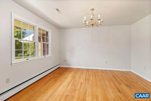 a kitchen with granite countertop wooden cabinets a sink and a window