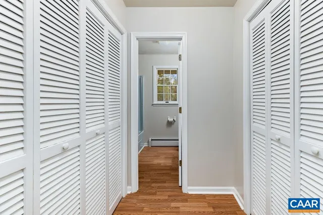 a view of an empty room with glass door