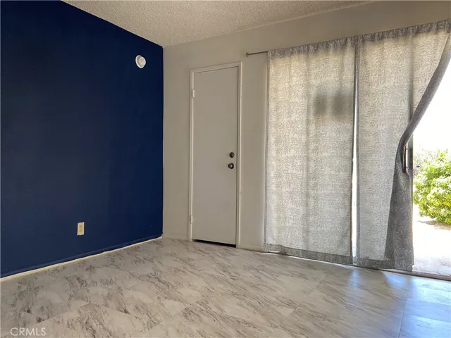 a view of a backyard with sitting area