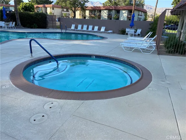 a view of a garden with sitting area