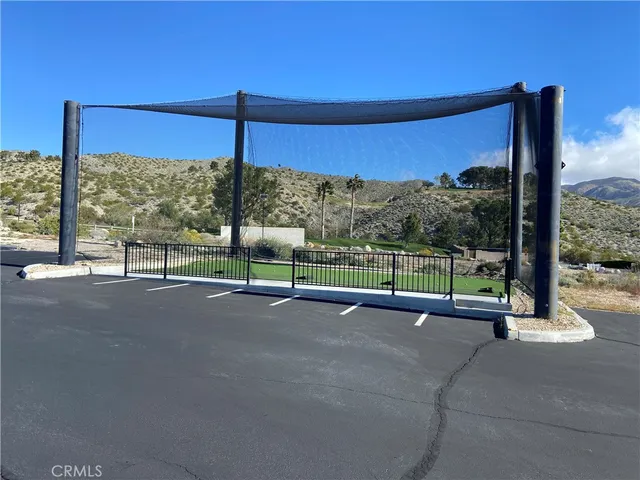 a room with chairs in it and windows