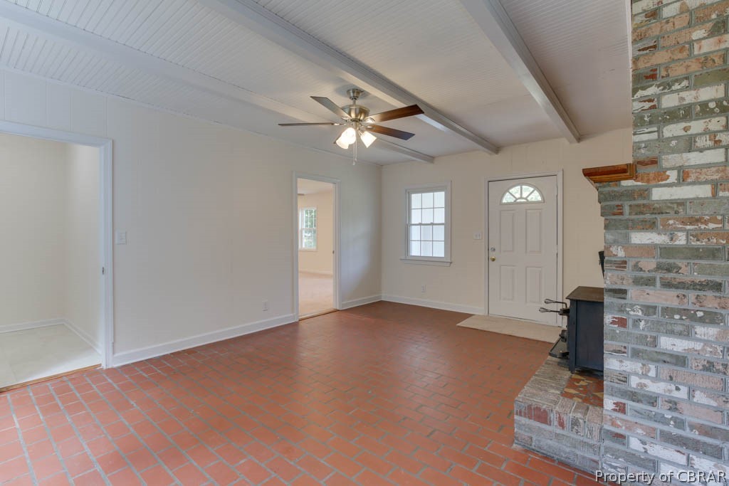 400 Showalter Road Yorktown, VA 23692 - Photo 20 of 49 Entrance foyer featuring brick wall, beam ceiling, and ceiling fan