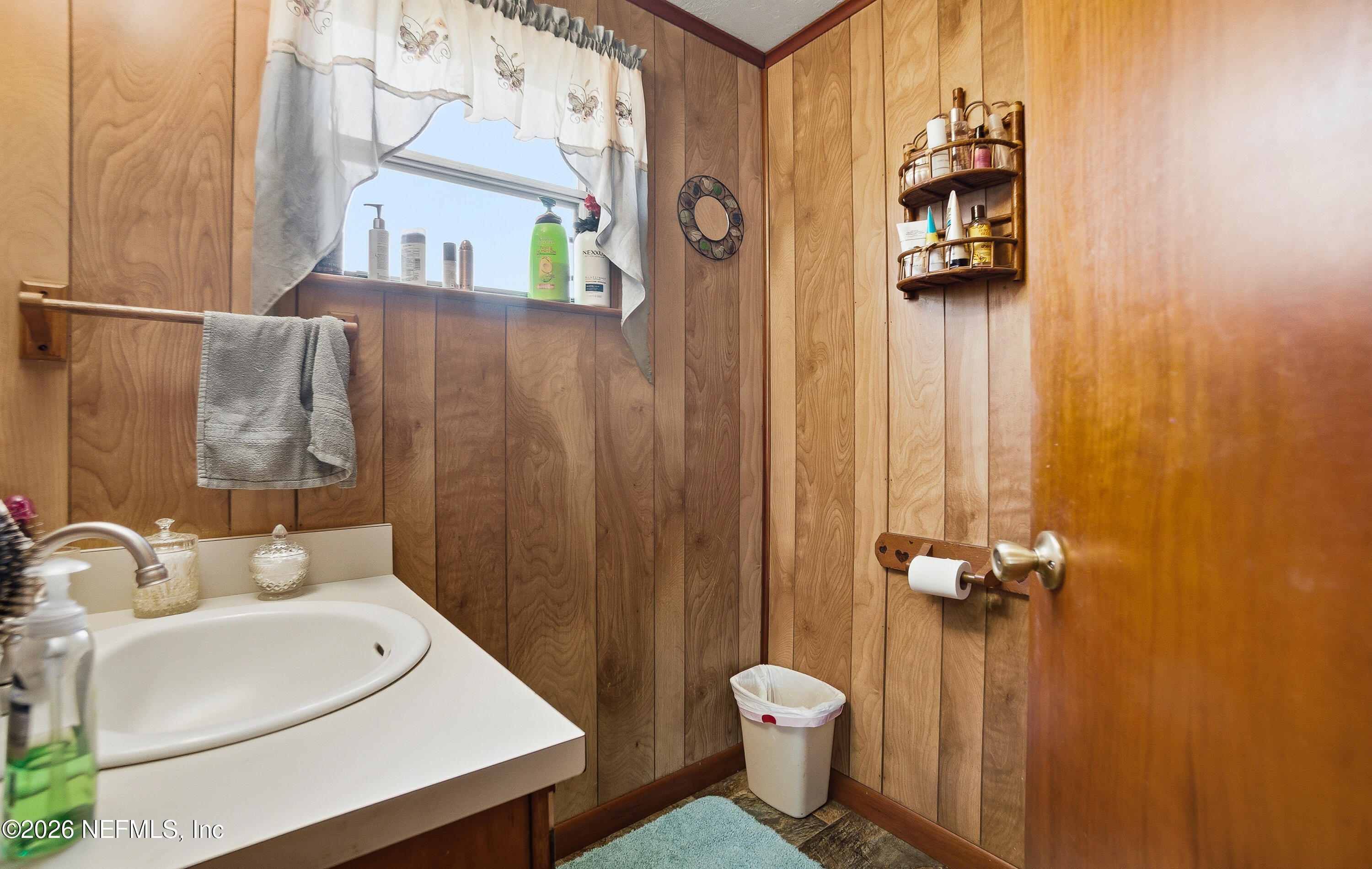 18273 Highway 16 Starke, FL 32091 - Photo 13 of 42 a bathroom with a sink toilet and shower