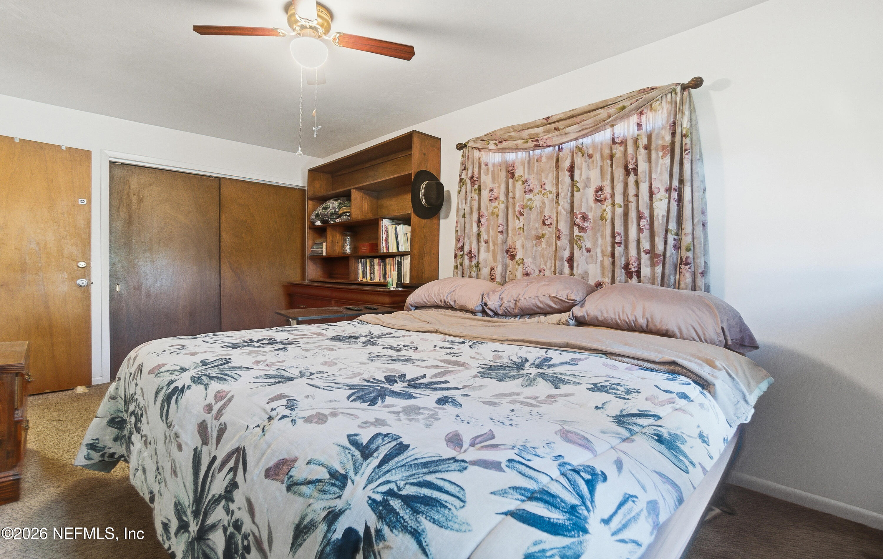 18273 Highway 16 Starke, FL 32091 - Photo 15 of 42 a bedroom with a bed and a dresser