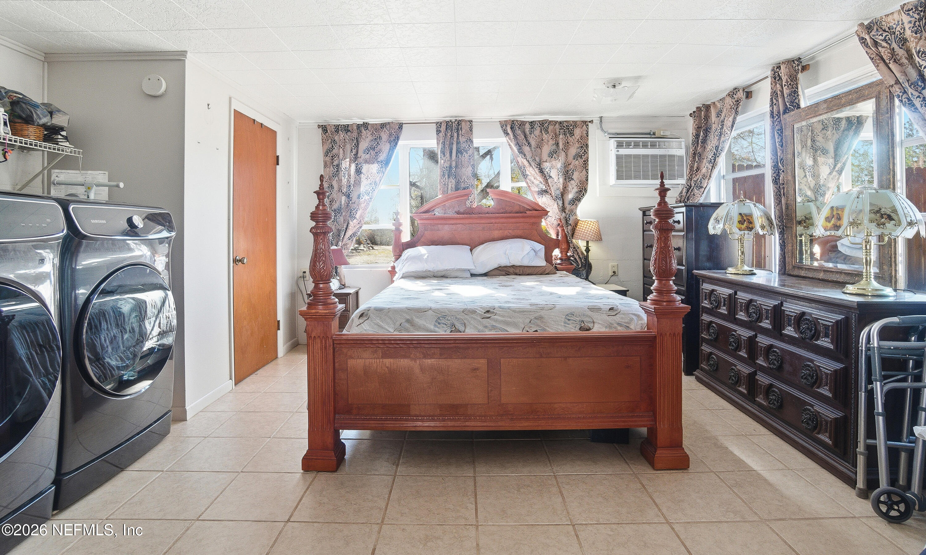 18273 Highway 16 Starke, FL 32091 - Photo 19 of 42 a bedroom with a bed and a window