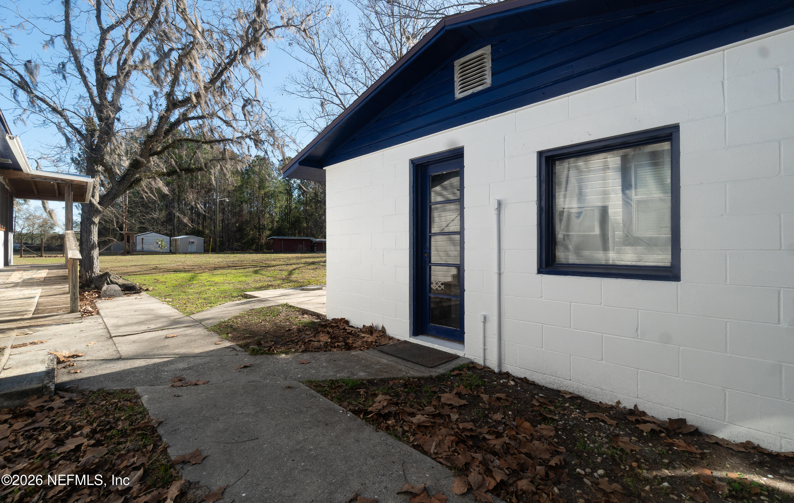18273 Highway 16 Starke, FL 32091 - Photo 25 of 42 a front view of a house with a yard