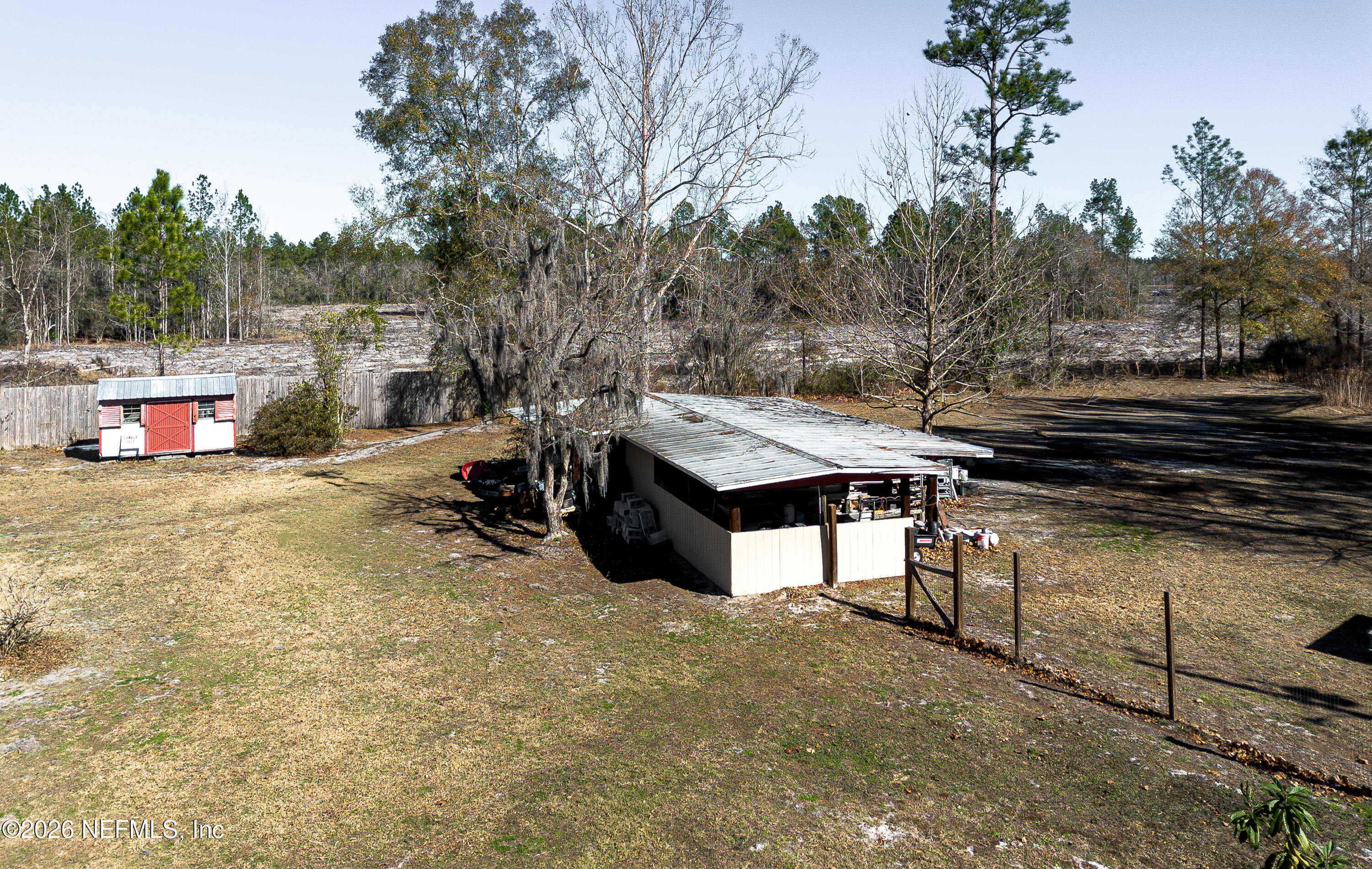 18273 Highway 16 Starke, FL 32091 - Photo 32 of 42 a view of a backyard with a wooden fence