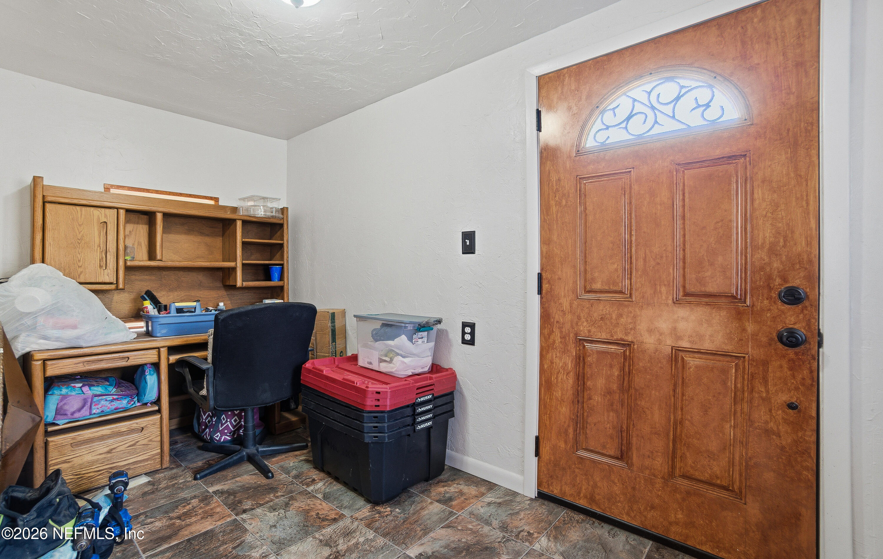 18273 Highway 16 Starke, FL 32091 - Photo 5 of 42 a room with furniture a flat screen tv and a fireplace