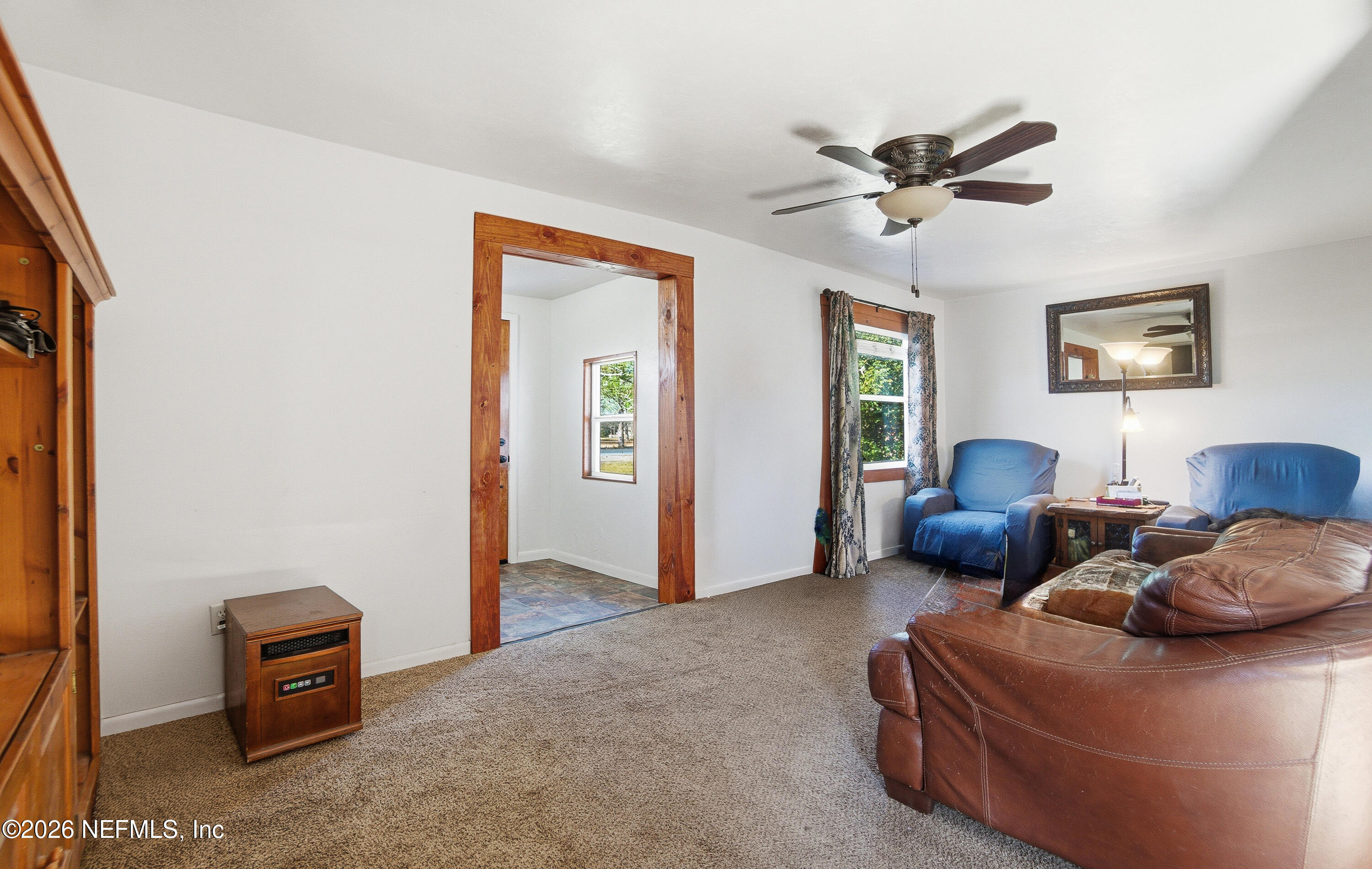 18273 Highway 16 Starke, FL 32091 - Photo 6 of 42 a living room with furniture a window and a ceiling fan