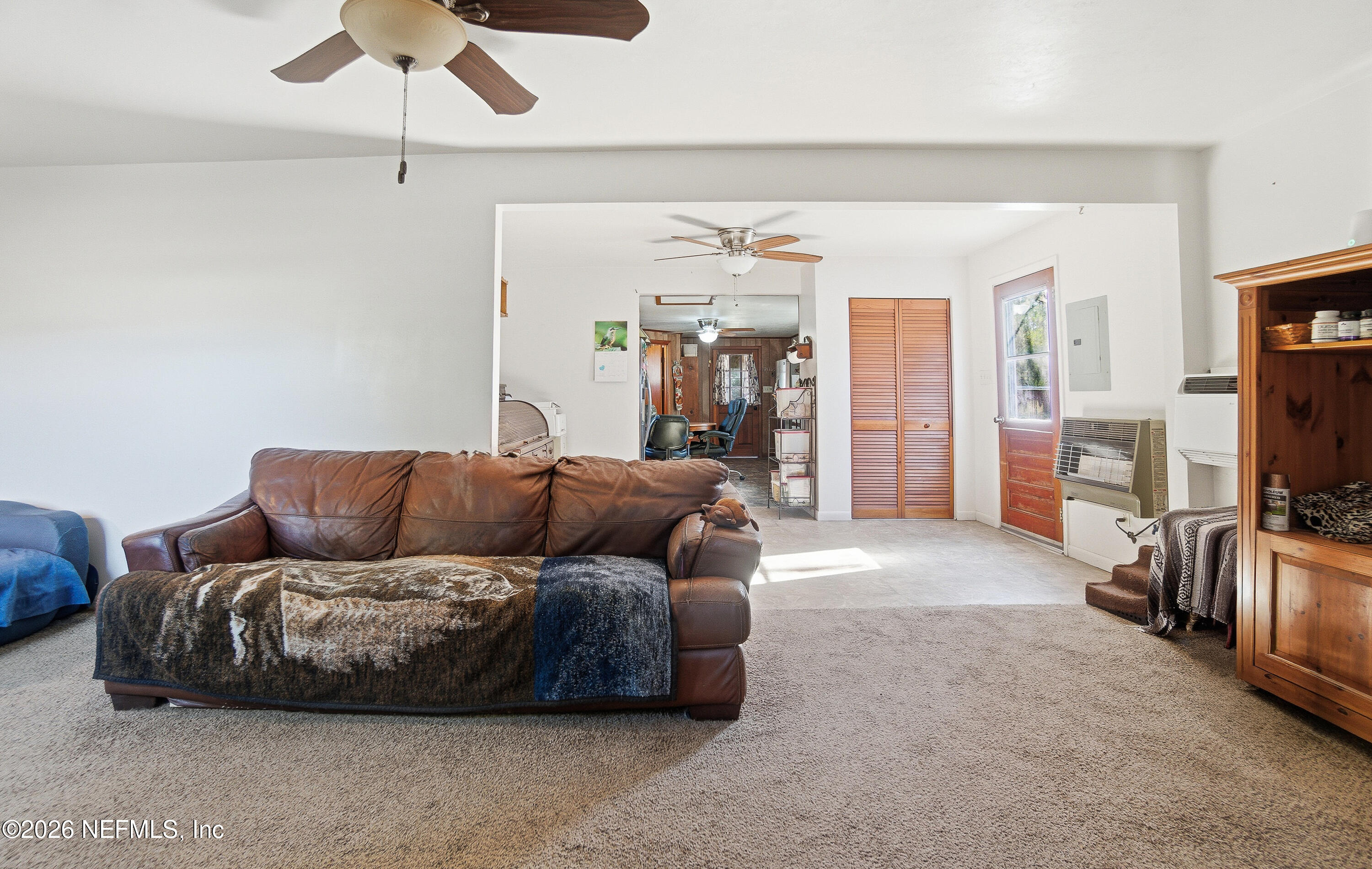 18273 Highway 16 Starke, FL 32091 - Photo 7 of 42 a living room with furniture and a flat screen tv