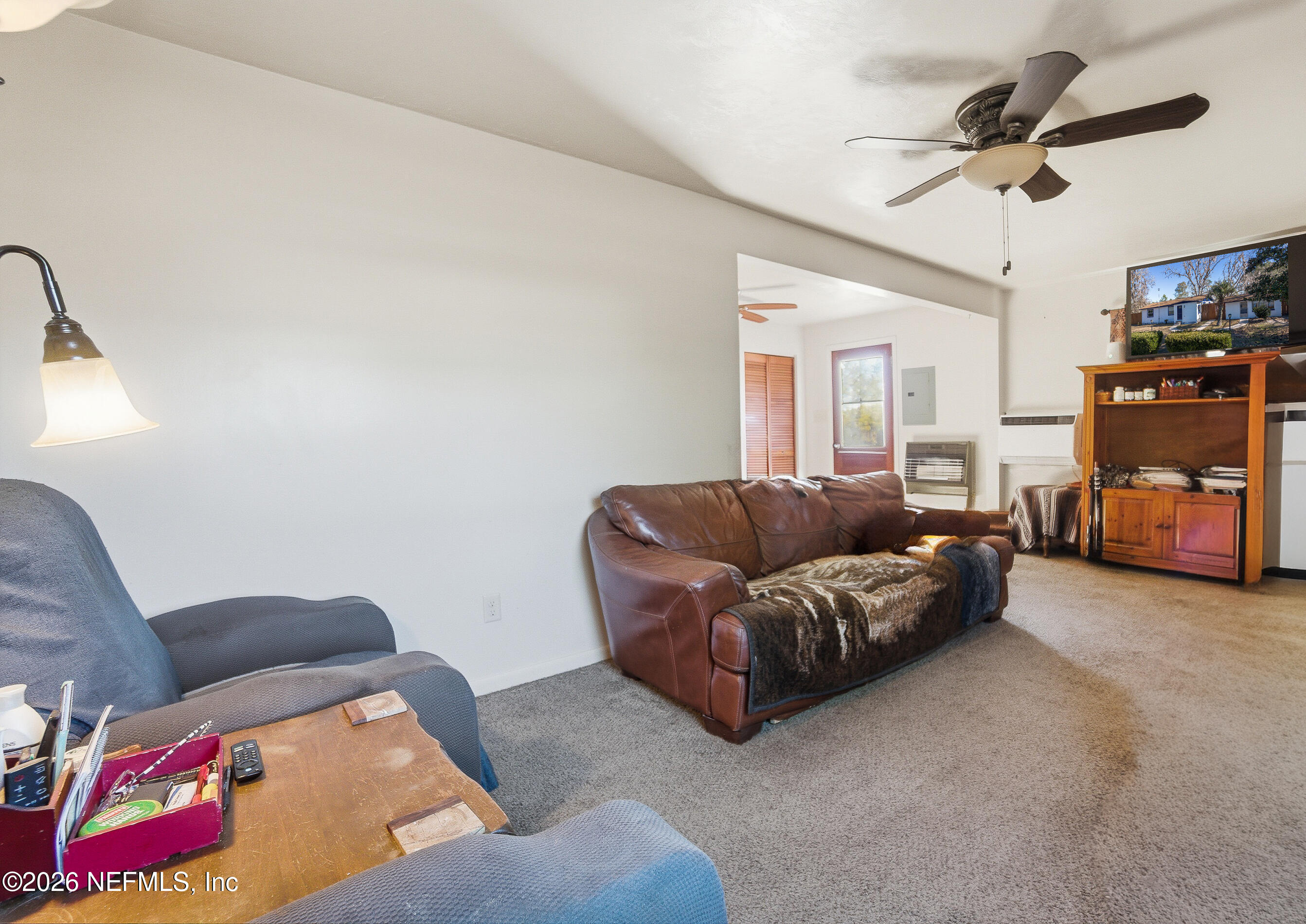 18273 Highway 16 Starke, FL 32091 - Photo 8 of 42 a living room with furniture and a ceiling fan
