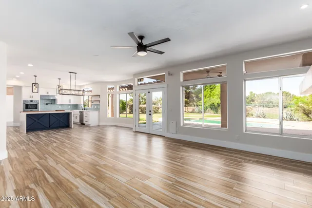 a kitchen with cabinets and window