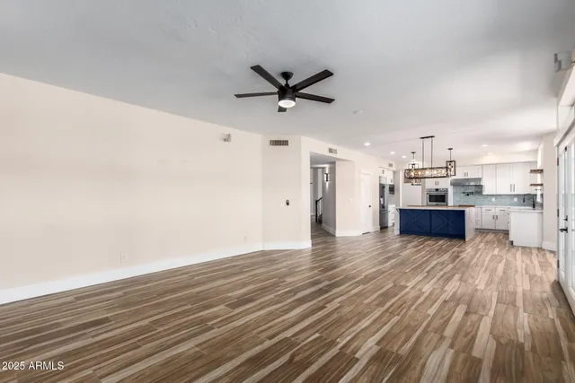 a view of a bathroom with wooden floor